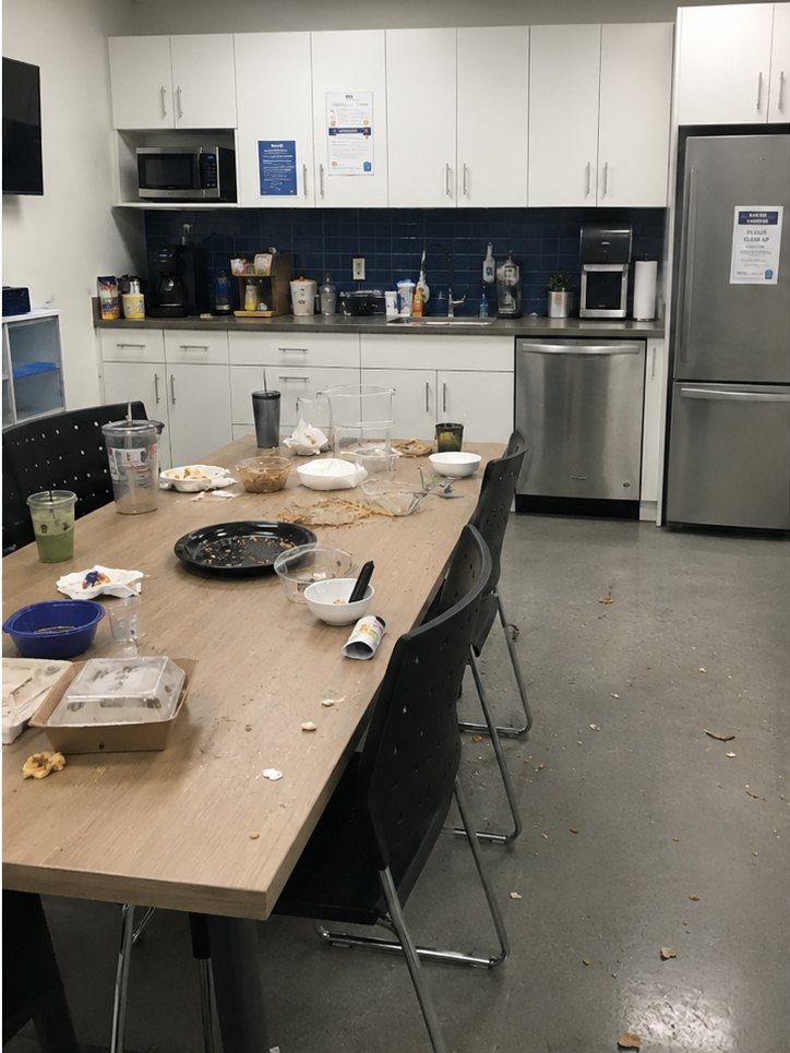 Cluttered staff lunchroom before cleaning